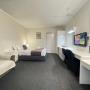 Queen Room with en-suite bathroom. Air conditioning & heating service. Comfort large double bed configuration with e-blanket. The room set up with a wide sofa bed, luggage storage, LED television, coffee maker, toaster, hair dryer & microwave. In room wireless connection with free on site parking close to room entrance. Housekeeping service available. (On request only)