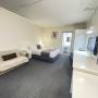 Queen Room with en-suite bathroom. Air conditioning & heating service. Comfort large double bed configuration with e-blanket. The room set up with a wide sofa bed, luggage storage, LED television, coffee maker, toaster, hair dryer & microwave. In room wireless connection with free on site parking close to room entrance. Housekeeping service available. (On request only)