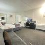 A Queen Room (Double Room) with private bathroom. Air conditioning & heating service. Comfort large double bed configuration with e-blanket. The room set up with a divan, luggage storage, LED television, coffee maker, toaster & microwave. In room wireless connection with free parking on site. Housekeeping service available. (On request only)