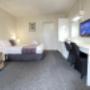 Standard Queen Room with en-suite bathroom. Air conditioning & heating service. Comfort large double bed configuration with e-blanket. The room set up with a divan, luggage storage, LED television, coffee maker, toaster, hair dryer & microwave. In room wireless connection with free parking on site located at motel courtyard. Housekeeping service available. (On request only)