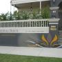 Handpainted sign on fence