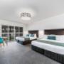 Deluxe guest room with two beds
