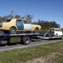 Project Vehicles in transit on Tilt Tray