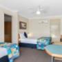 Guest room with three beds