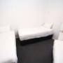 Guest room with three beds