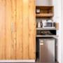 Guest room with microwave and refrigerator