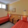 Guest room with three beds