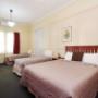 Guest room with three beds