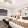 Guest room with three beds