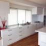 Clean, crisp white kitchen renovation with plenty of storage space in Mt Martha