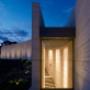 Curved limestone rammed earth front entrance wall
Featuring 18W we-ef Compact Florescent DALI Up lighters. Port Phillip Estate