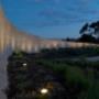 Curved limestone rammed earth front entrance wall
Featuring 18W we-ef Compact Florescent DALI Up lighters - Port Phillip Estate