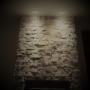 Spotlights on stone chimney