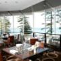 Restaurant with beach view at Novotel Sydney Brighton Beach hotel