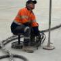 Man fixing sunken Foundation