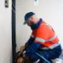 Man fixing subsidence problem