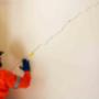 man fixing cracked wall