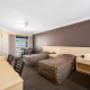 Guest room with three beds