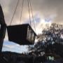 skip bins lifted by crane