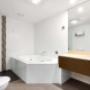 Whirlpool bathtub in bathroom