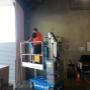 Technician working on roller door