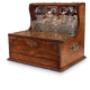 Oak three bottle tantalus with secret cigar drawer