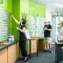 One of our staff helping a customer choose new glasses