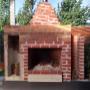 Outdoor fireplace with wood storage under a veranda in Darleith Terrace, Caroline Springs.