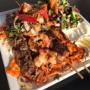 Gourmet Mixed Platter (Chicken, Lamb, Prawn, & Kofta Skewers serve with salad, hommus, garlic sauce, and rice or chips).