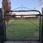 Adding that extra touch to a small gate separating paddocks.