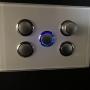 Glass switch plate in White with push button switches. Easily dim your lighting up and down by pushing and holding. Glass switch & GPO plates available in various colours.