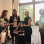 Handing over a cheque to Doris Woman's Refuge