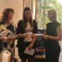 Handing over a cheque to Doris Woman's Refuge