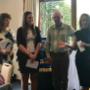 Handing over a cheque to Doris Woman's Refuge