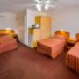 Guest room with three beds