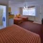 Guest room with three beds