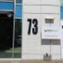 The exterior of Semitech Semiconductor's headquarters, showcasing the company's branding and modern office facade with a clear view of the "73" building number and Semitech signage.