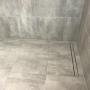 Slimline drainage in this renovated bathroom shower recess