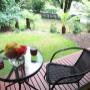 Step from the Queen Room to a patio overlooking the garden. Enjoy the bird songs and tranquility. Very private.