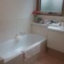The bathroom has a bath, standard shower and vanity, shampoo, hair conditioner, body wash, soap, lotions, hair dryer, heater, extra towels and an infant’s bath if required. The toilet is separate.