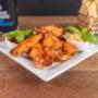 Five-piece buffalo wings served at Coffee & Dreams on Gouger Street, Adelaide, available as an all-day bite or takeaway food option.