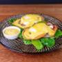 Eggs Benedict served at Coffee & Dreams on Gouger Street, Adelaide, with poached eggs, spinach, bacon, and hollandaise sauce on an English muffin.