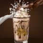 Large milkshake served at Coffee & Dreams on Gouger Street, Adelaide, available for dine-in, pickup, or takeaway.