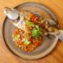 Baby Barramund - Whole crispy fried baby barramundi topped with tangy tamarind & lime glaze