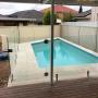 Pool coping and water line tiles completed by Dream Stone Landscapes