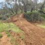 Road construction, excavator, drainage pipes