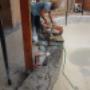 Pool Restoration Sunbury - Demolition, saw cutting pebbles off the pool