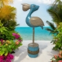 Pelican On Log Statue