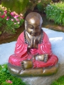 Red Praying Buddha Statue