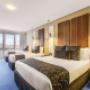 Guest room with three beds
